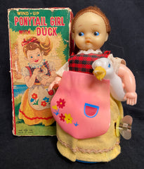 Vintage Wind Up TN Japan Ponytail Girl With Duck